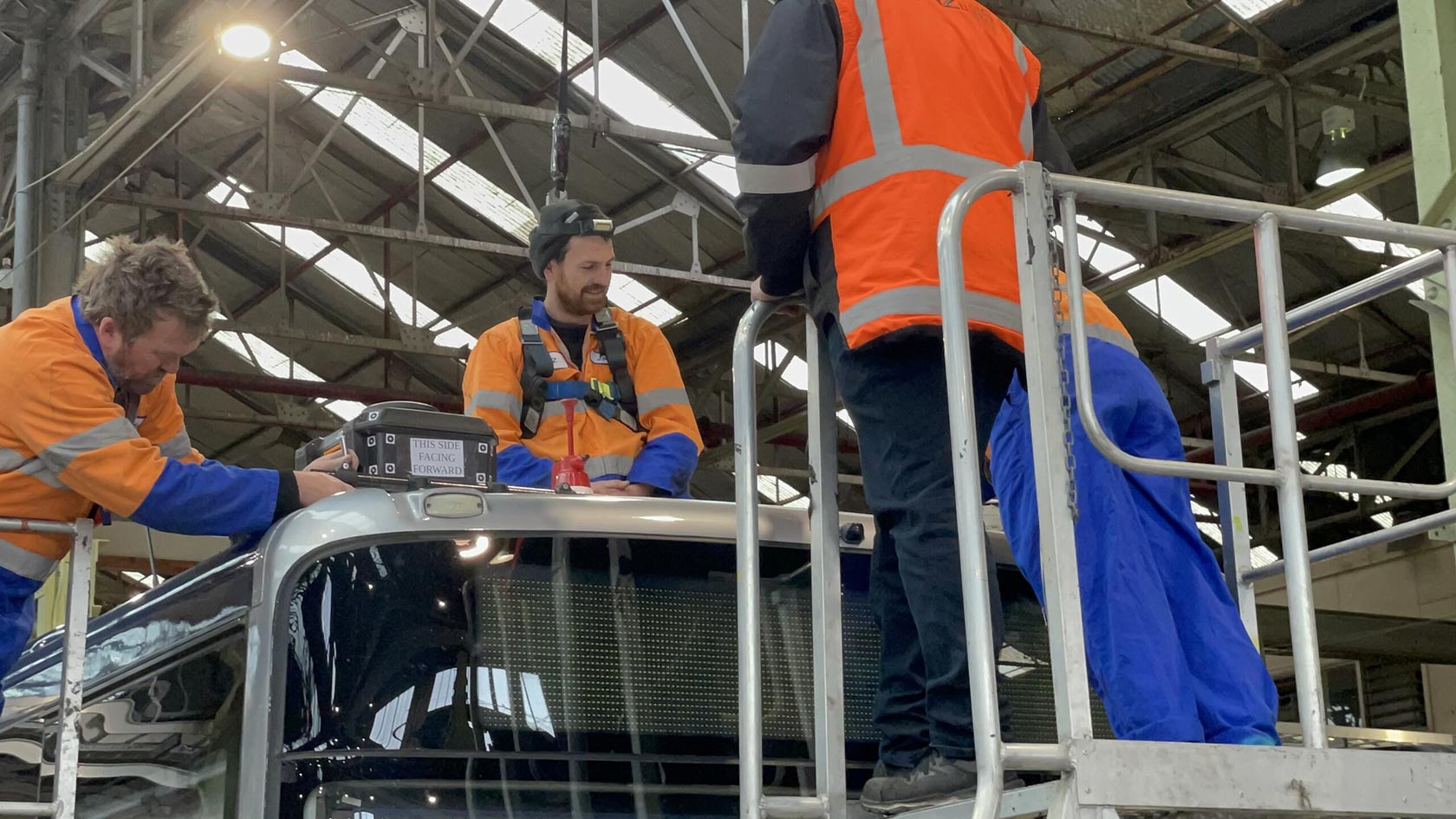Technicians installing GPSat
