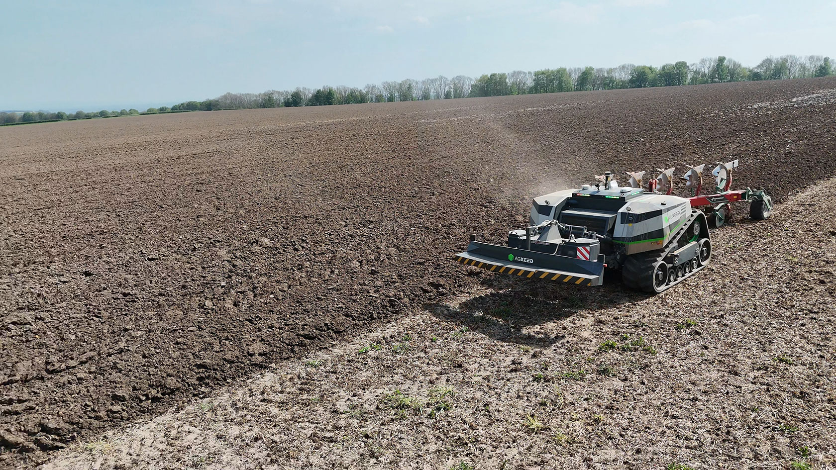 AgXeed’s AgBot autonomous tractor ploughing a field.